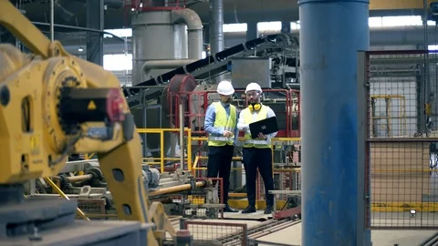 Professional engineers check equipment at a brick factory. Stock Footage 116342480
