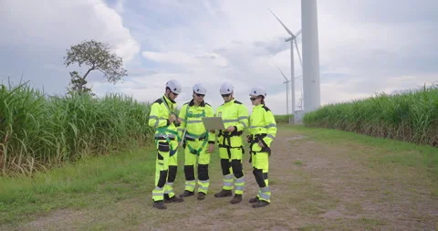 Professional engineers checking wind turbine operation at renewable energy site, 스톡 동영상 330761312