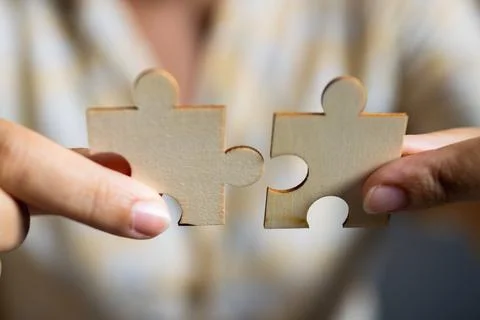 Professional environment teamwork concept with collaboration puzzle pieces .. Stock Photos
