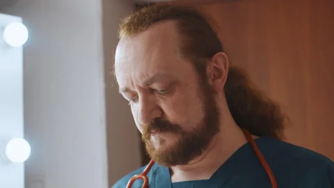Professional equips mask and stethoscope promptly. Paramedics and responders Video stock 337553360