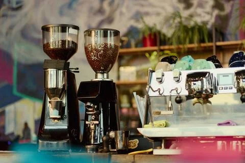 Professional Espresso Machine and Coffee Grinders in Modern Cafe Stock Photos