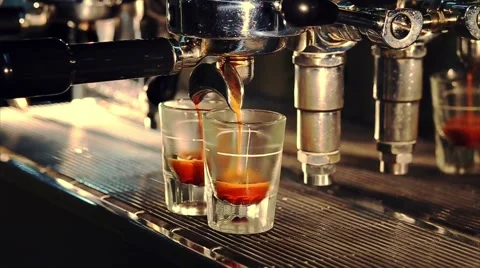 Professional espresso machine brewing a coffee in bar. Coffee pouring into shot Stock Footage 63431095