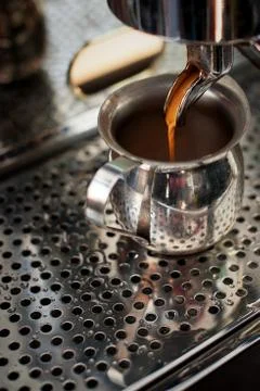 Professional espresso machine making strong fresh coffee. Stock Photos