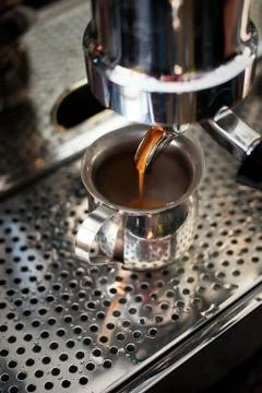 Professional espresso machine making strong fresh coffee. Stock Photos