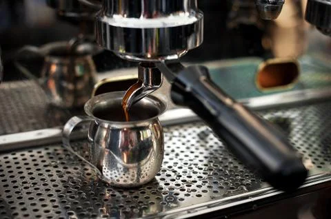 Professional espresso machine making strong fresh coffee. Stock Photos