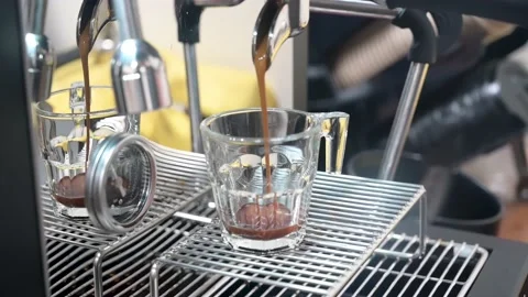 Professional espresso machine pouring strong looking fresh coffee Stock Footage 236453664