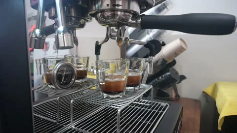 Professional espresso machine pouring strong looking fresh coffee Stock Footage 236904265