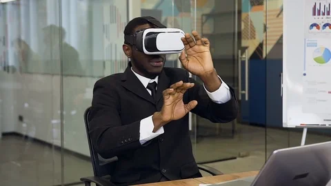 Professional experienced 30-aged dark-skinned male manager in special virtual 3d Stock Footage 124845934