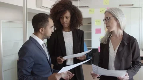 Professional explaining document details to colleagues Stock Footage 137512806