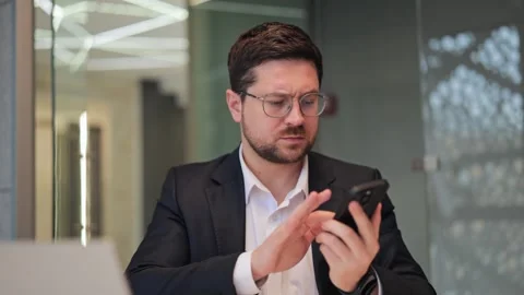 Professional Expresses Confusion During Smartphone Business Communication Stock Footage 330041220