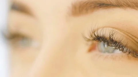 Professional Eye makeup artist applying eyeshadow powder. Beautiful woman face Stock Footage 74427161