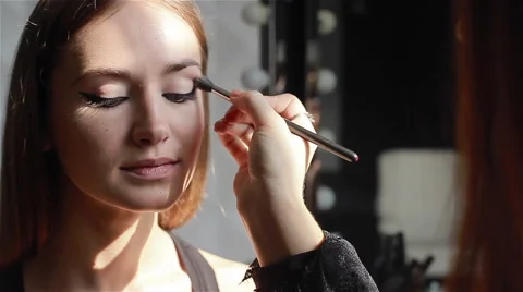 Professional eyeshadow application using a brush. Close-up Stock Footage 52992603