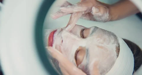 Professional Facial Massage in a Spa Setting Stock Footage 323604279