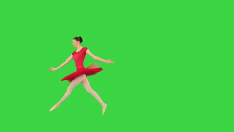 Professional female ballet dancer doing a twine jump on a Green Screen, Chroma Stock Footage 150387961