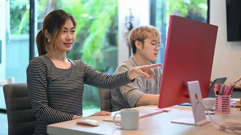 Professional female coding programmers working on web site project in corporate Stock-Fotos