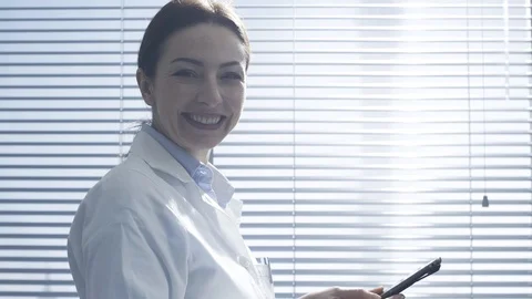 Professional female doctor using a digital tablet Stock Footage 117922283