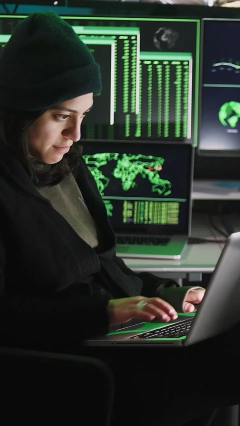 Professional female hacker typing virus code on laptop for cyber attack Video stock 316850073