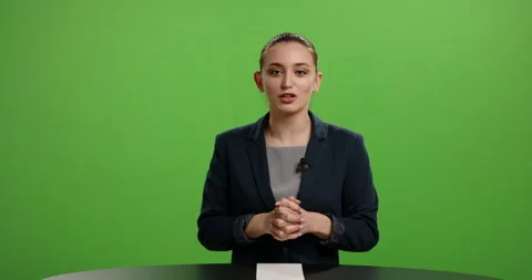 Professional female journalist talking into a camera and expressively gesturing Video stock 144451623