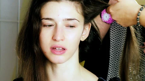 Professional female model without makeup getting hair done Stock Footage 36575040
