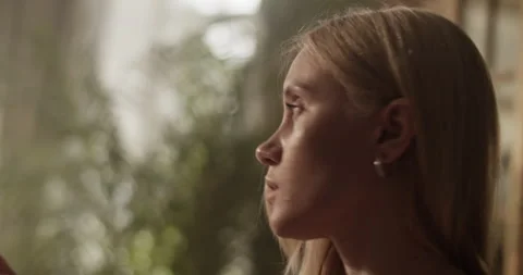 Professional female painter looking at model while painting on canvas Video stock 251522907