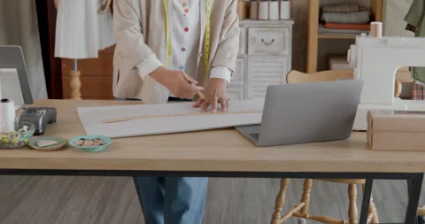 Professional Female Tailor Drafting Clothing Patterns With Pencil And Ruler.. Stock Footage 340133257