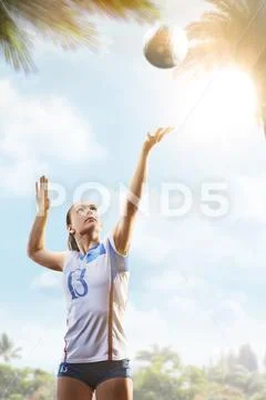 Professional female volleyball player in action on the court Stock Photos