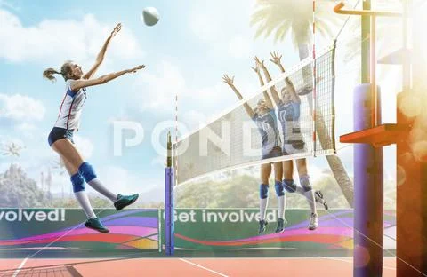 Professional female volleyball players in action on the court Stock Photos