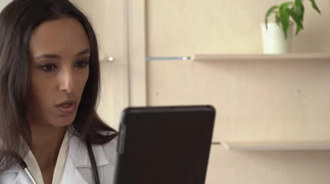 Professional female work as physician chatting via internet Stock Footage 65215044