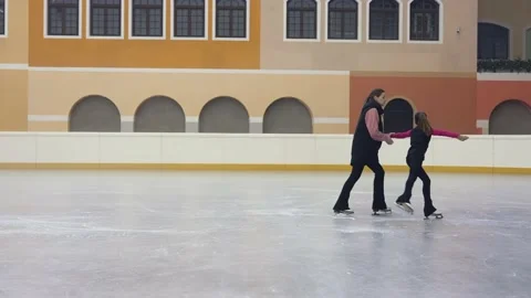 Professional figure skating coach explaining girl on skate how to move, taking Stock Footage 209492081