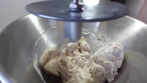Professional food processor kneading dough in metal bowl Stock Footage 333643074