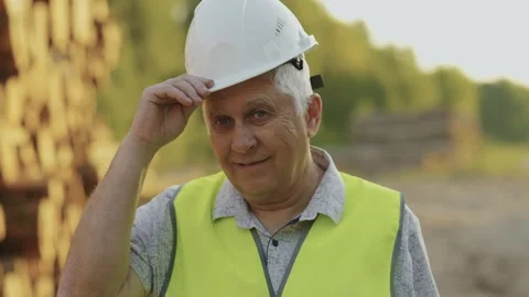 Professional forestry engineer in uniform wearing protective helmet. Slow motion Video stock 242625046