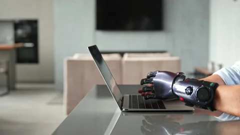 Professional freelance programmer with artificial bio hand Stock Footage 157348148