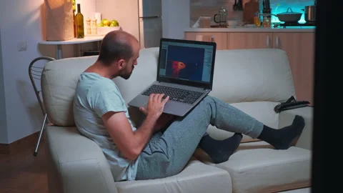 Professional game developer working on gameplay and game level late at night Stock Footage 150878433