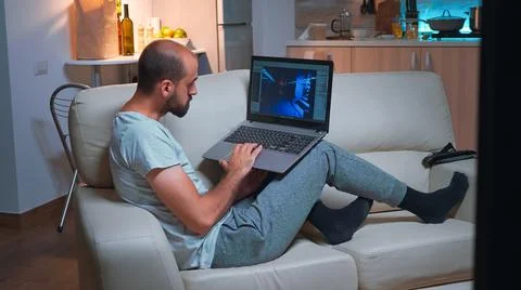 Professional game developer working on gameplay and game level late at night 写真素材