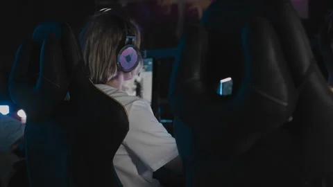 Professional gamer is playing a computer game on PC at cyber club. Player is Stock Footage 300338115