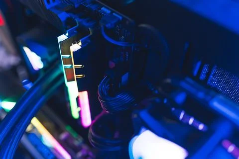 Professional gaming computer setup close-up. Glowing parts in rainbow colors and Foto stock
