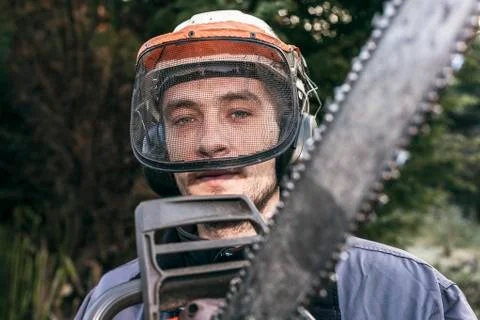 Professional gardener with chainsaw Stock Photos