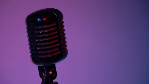 Professional glare microphone. Light of the pink spotlight shine on a chrome mic Video stock 118527870