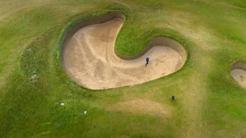 Professional golfer practicing bunker shot from above 스톡 동영상 336792755