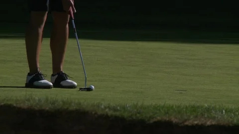 Professional golfer putting(close up). Stockbeeldmateriaal 76781138