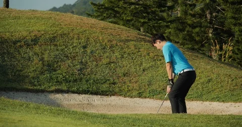 Professional golfer training to play golf on the golf course. Stock Footage 120111769