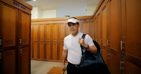 Professional golfer walking locker at golf club. Stock Footage 103856429