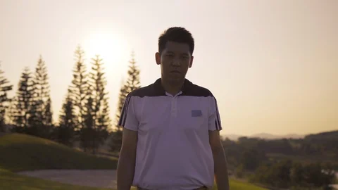 Professional Golfing walking go to Putting with putter hit the golf ball Stock Footage 120026751