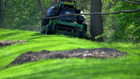 Professional grass cutting service with a large lawn mower, landscaping service. Stock Footage 334062996