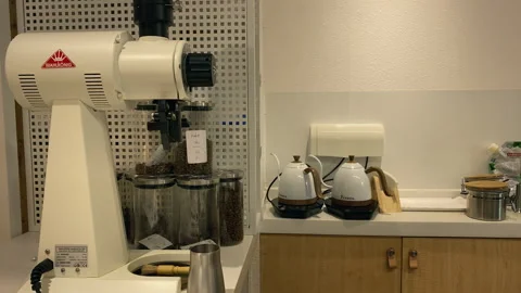 Professional grinder and coffee beans in the corner of the coffee shop 스톡 동영상 300306268