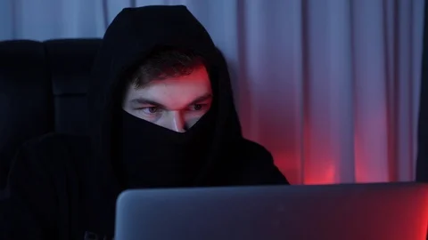 Professional hacker looking at screen and breaking password on computer. Close Video stock 125213311