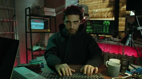 Professional hacker typing on keyboard at night, breaking password, using laptop 動画素材 158620590