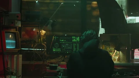 Professional hacker typing on keyboard at night, trying to break password, using Stock Footage 158622749