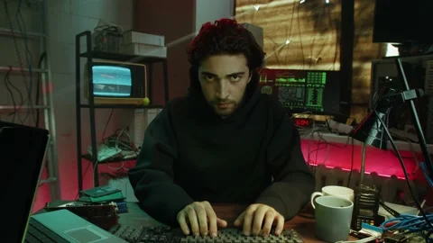 Professional hacker typing on keyboard at night, breaking password, using laptop Stock Footage 163679781