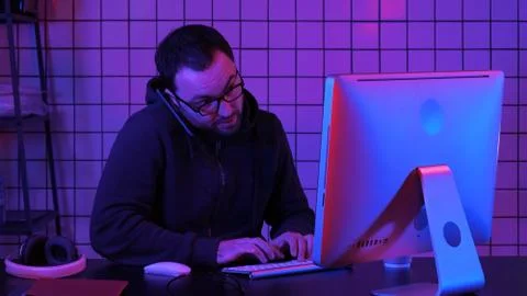 Professional hacker using mobile cell phone talking and spreading bad data virus Stock Photos